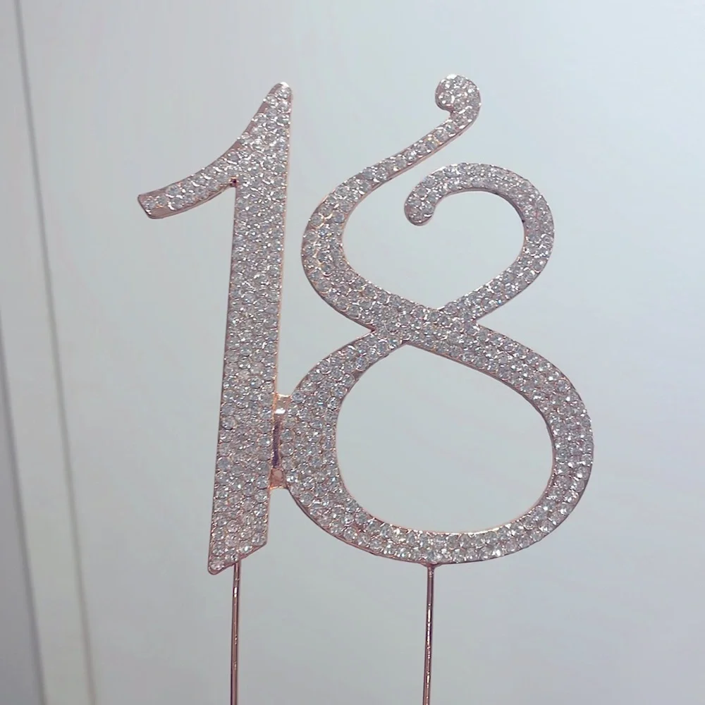 The cake topper, rose gold with rhinestones
